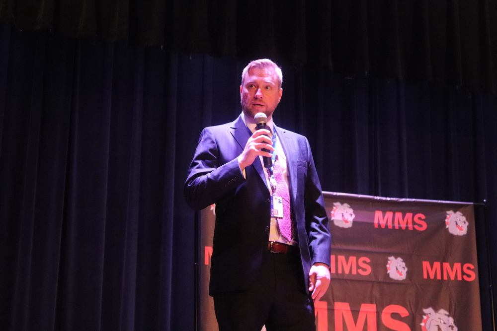 Martinsville vice mayor Aaron Rawls speaks into a microphone