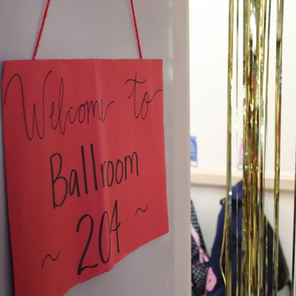 A sign on a classroom door reads "Welcome to Ballroom 204"