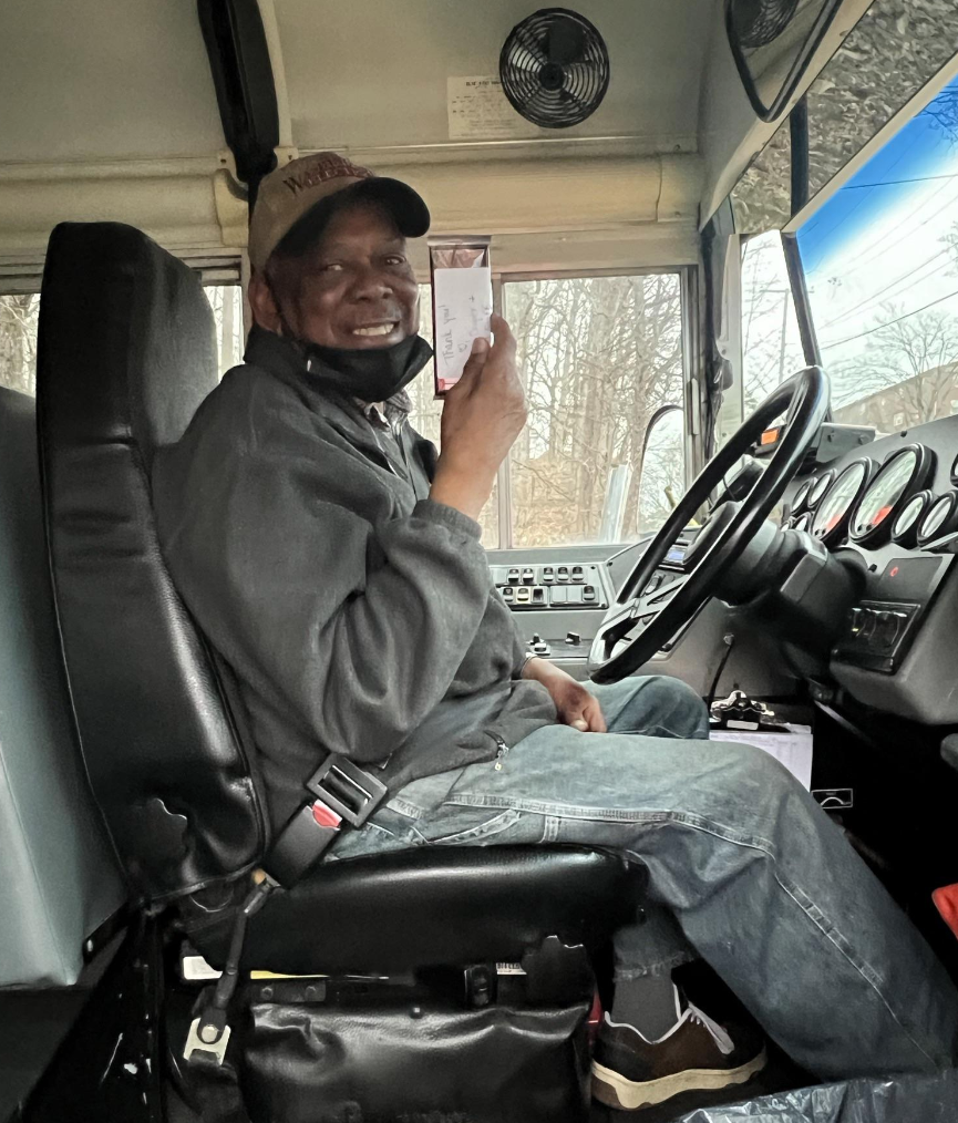 Bus driver holding candy bar
