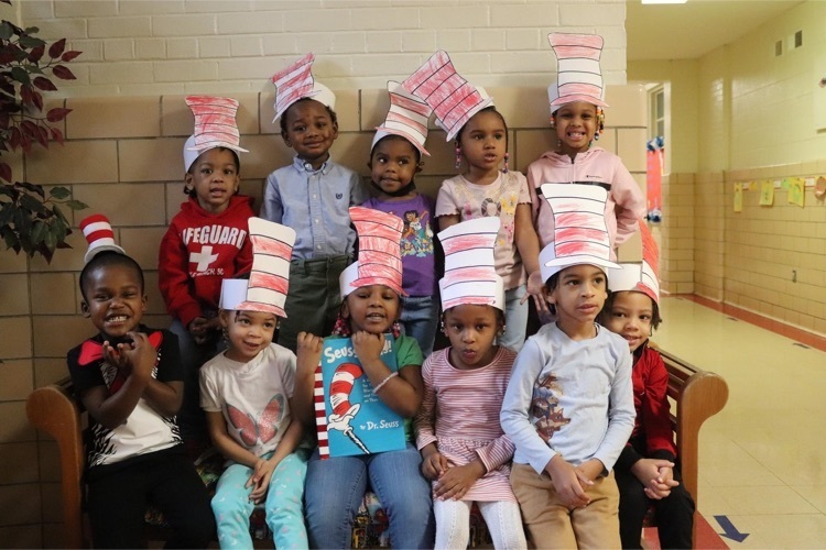 Clearview class poses wearing their paper Dr. Seuss hats