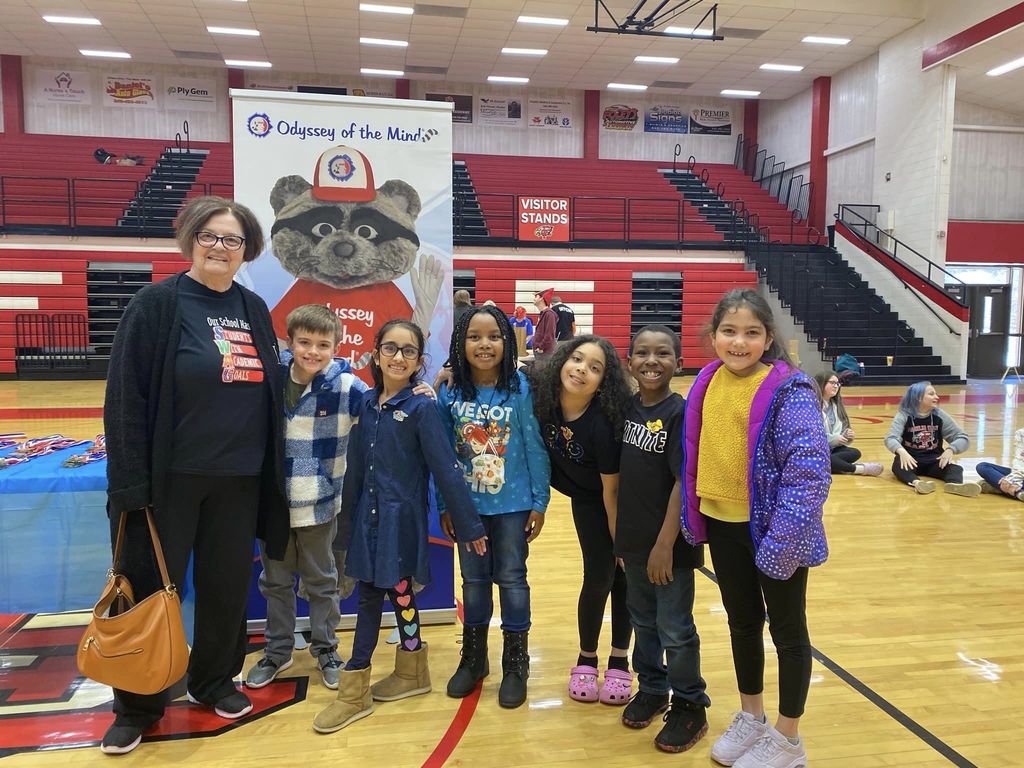Elementary Odyssey of the Mind team with their coach