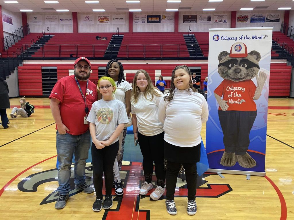 Elementary Odyssey of the Mind team with their coach