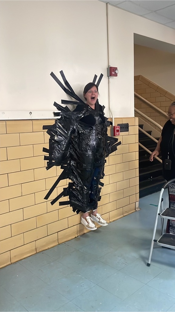 PHES Principal Cameron Cooper is duct taped to a wall