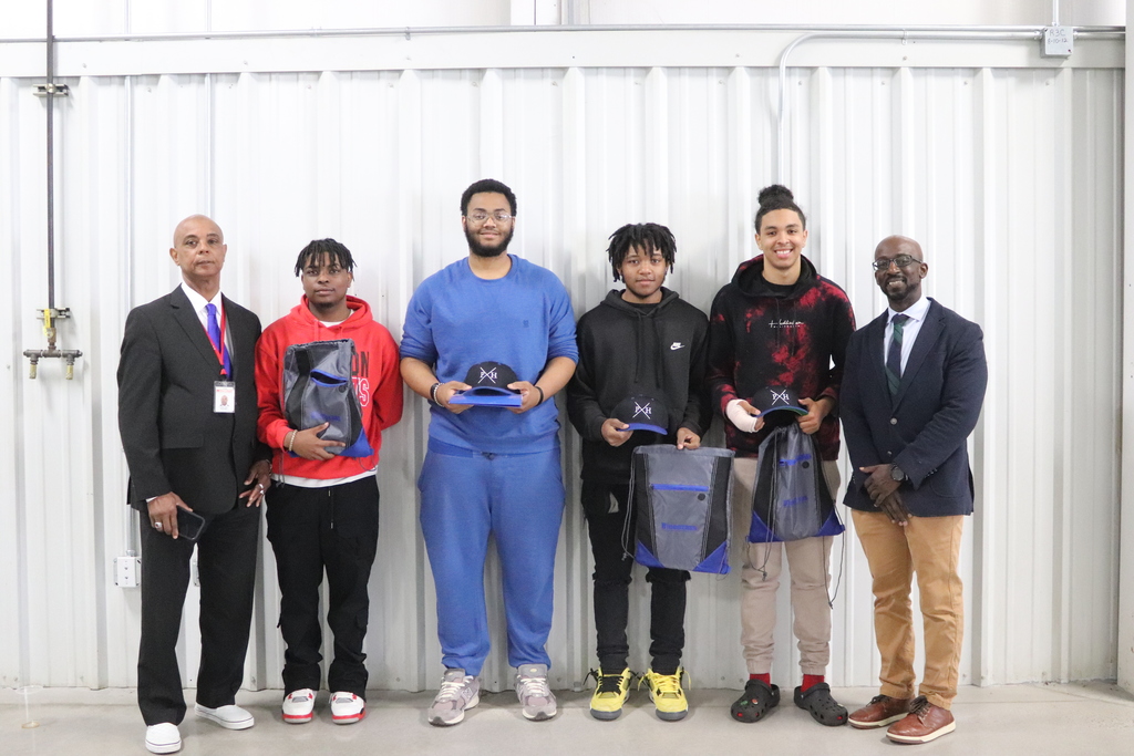 MHS students pose with their P&HCC gear alongside MHS principal Dr. Aji Dixon and MCPS superintendent Dr. Zeb Talley
