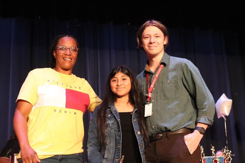 two MMS teachers pose with student